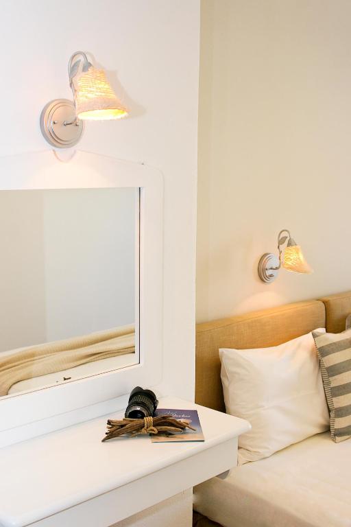Postel nebo postele na pokoji v ubytování Paradissos Hotel