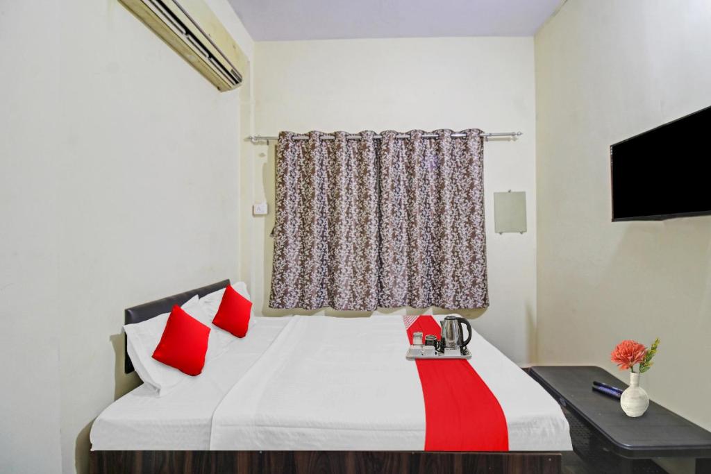 Ένα ή περισσότερα κρεβάτια σε δωμάτιο στο Hotel O Mr
