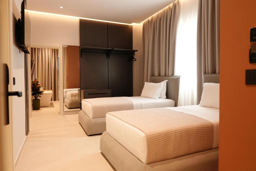 Postel nebo postele na pokoji v ubytování Hotel Natica