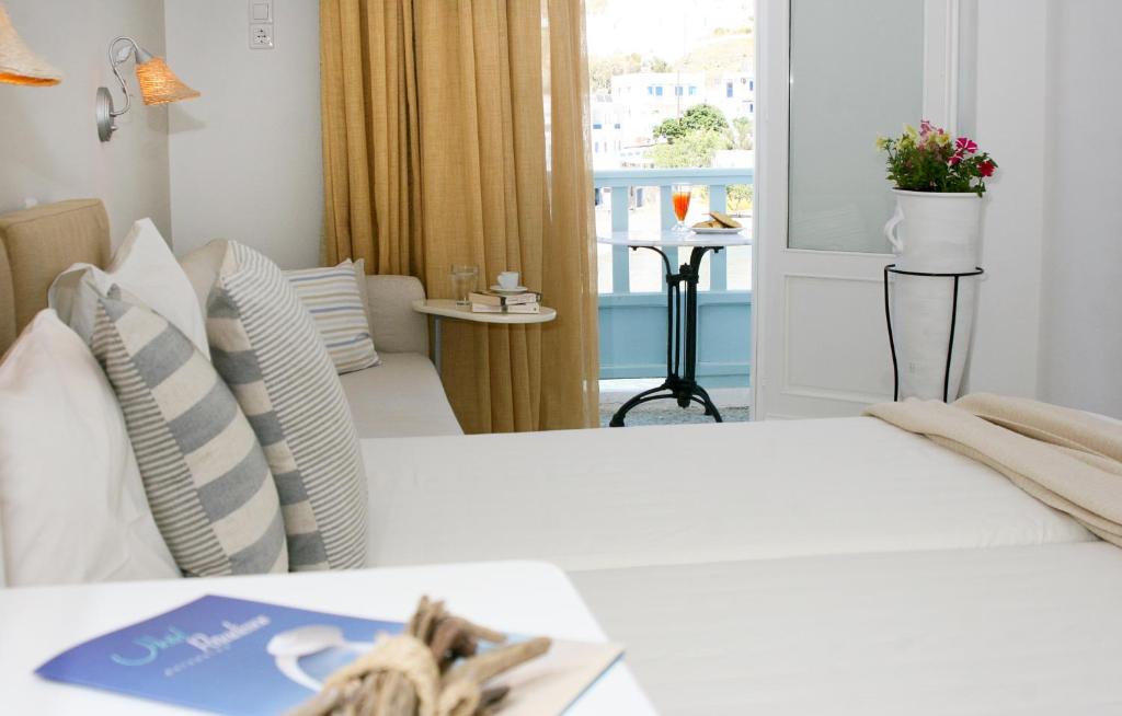 Postel nebo postele na pokoji v ubytování Paradissos Hotel