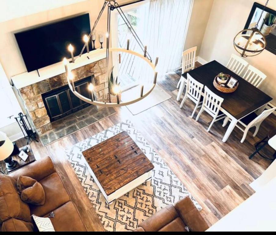 a living room with a couch and a chandelier at Hope's Hideaway in Blakeslee