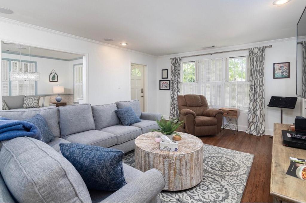 a living room with a couch and a table at Walk to Oxford Square, Faulkner house, Ole Miss in Oxford
