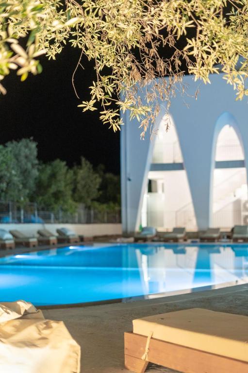 a view of a swimming pool at night at Ulin Boutique Hotel in Borsh