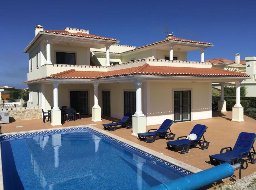 Image showcasing Luxury villa with private pool view of golf course and ocean، Amoreira ...