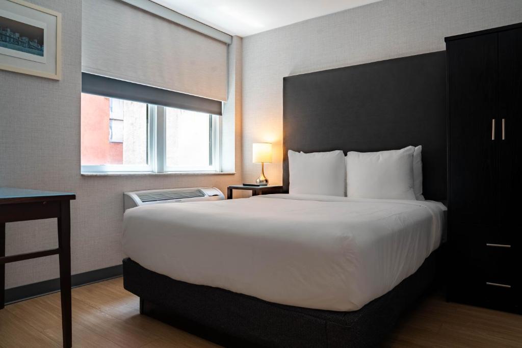 En eller flere senge i et værelse på Solita Soho Hotel