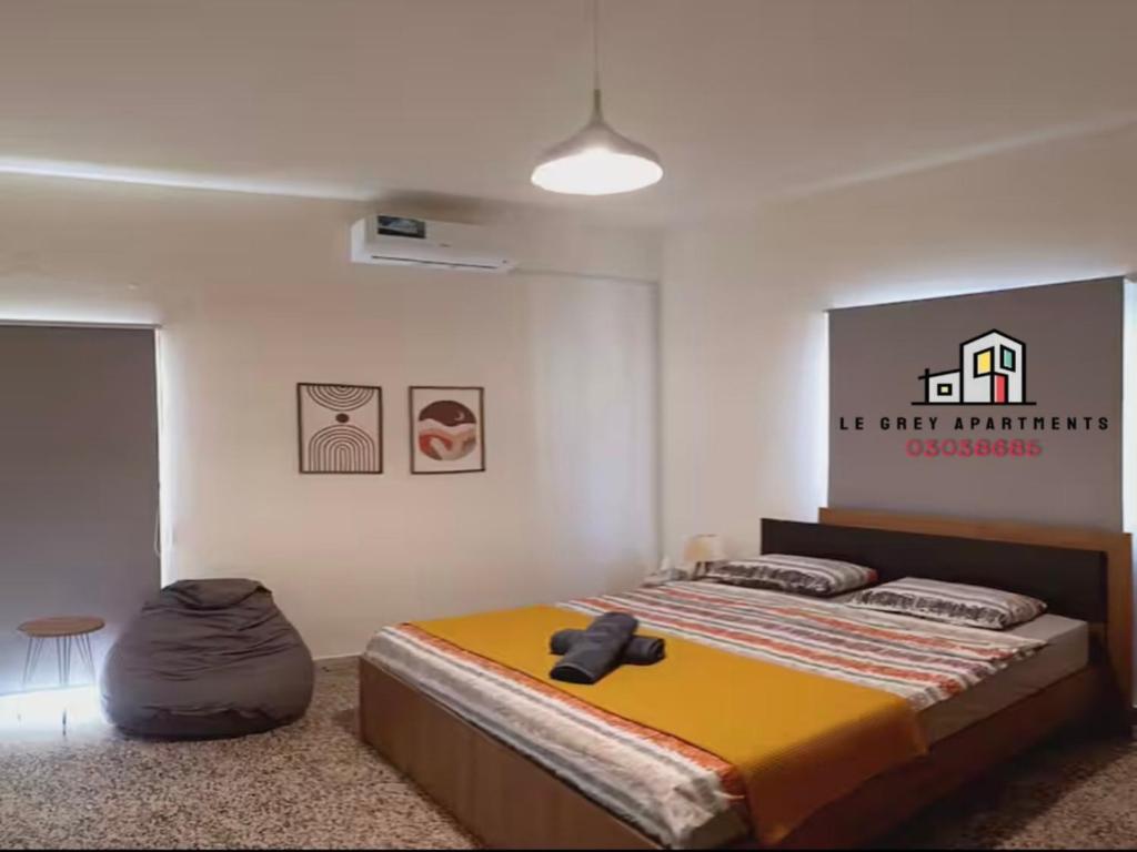 Postel nebo postele na pokoji v ubytování Batroun Le Grey