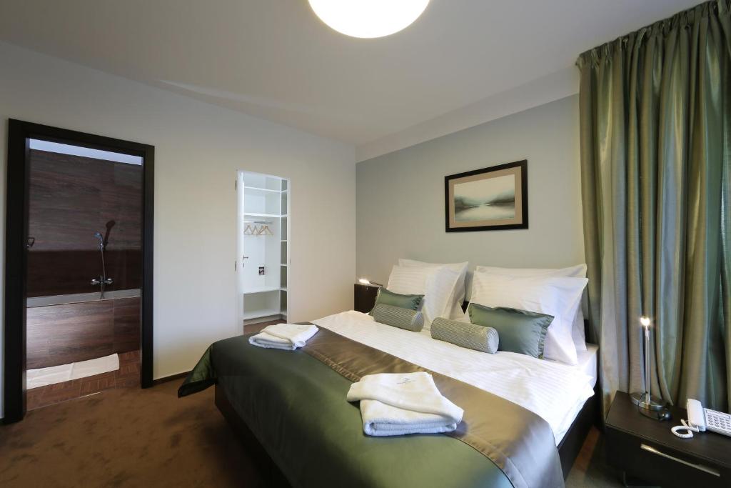 Postel nebo postele na pokoji v ubytování Hotel Zelená Lagúna