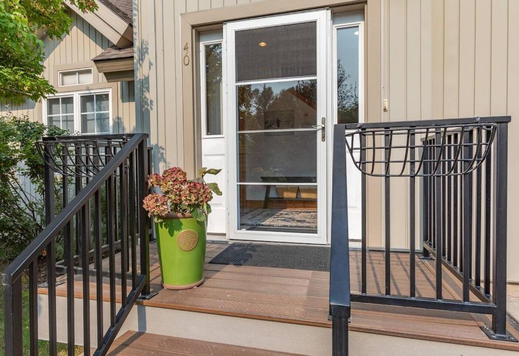 a front door of a house with a vase of flowers at Aspen Serenity - Hiking - in the Teton Valley in Driggs