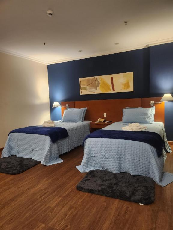 Ένα ή περισσότερα κρεβάτια σε δωμάτιο στο Suíte Aconchegante no Coração da Barra