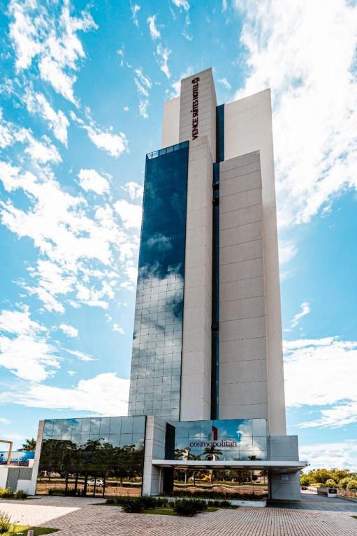 a tall white building with a sky in the background at STAY Vivence Suítes in Palmas