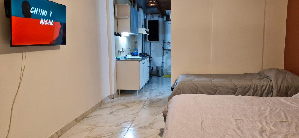 En eller flere senge i et værelse på Tiempos patagónicos de reflexión