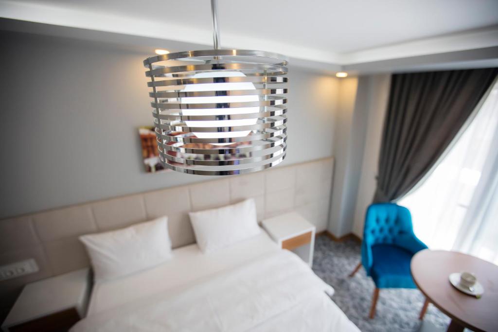 Postel nebo postele na pokoji v ubytování Royal İnci Hotel