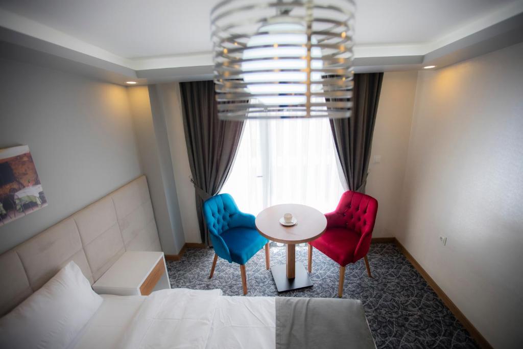 Postel nebo postele na pokoji v ubytování Royal İnci Hotel