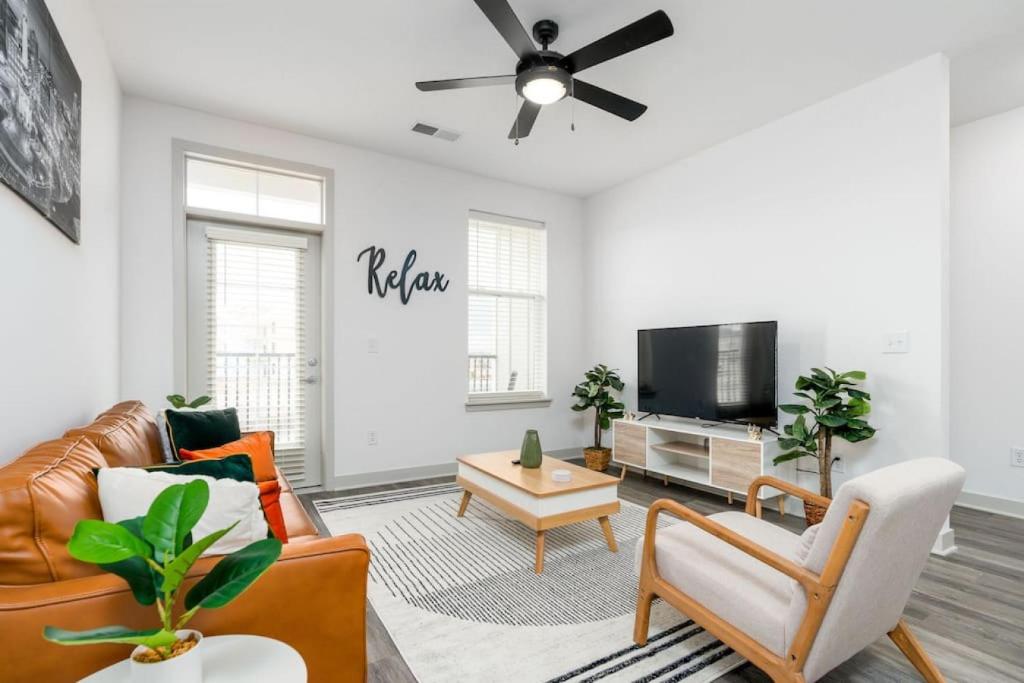 a living room with a couch and a tv at Affordable 2-Bedroom Whitestown in Whitestown