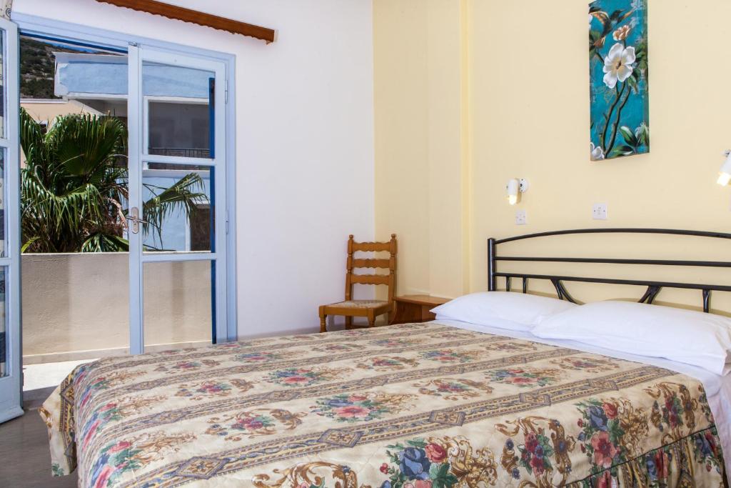 Postel nebo postele na pokoji v ubytování Akis Hotel
