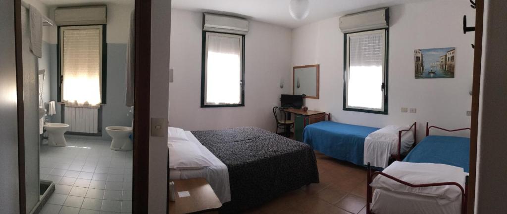 Postel nebo postele na pokoji v ubytování Hotel Stazione