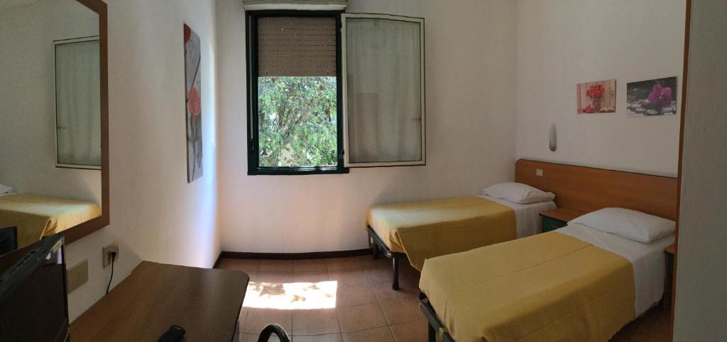 Postel nebo postele na pokoji v ubytování Hotel Stazione