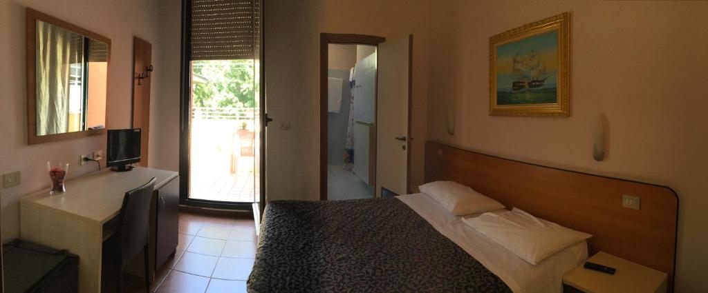 Postel nebo postele na pokoji v ubytování Hotel Stazione