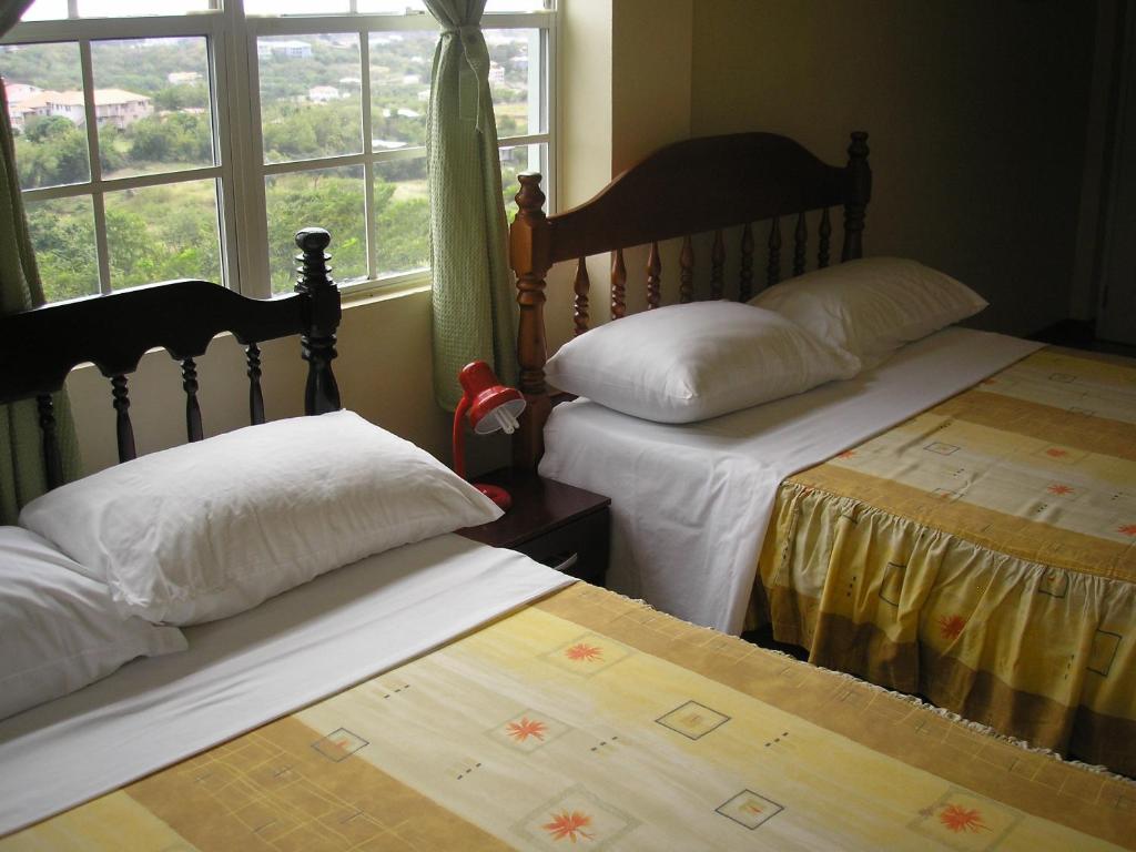 Postel nebo postele na pokoji v ubytování The Relax Inn