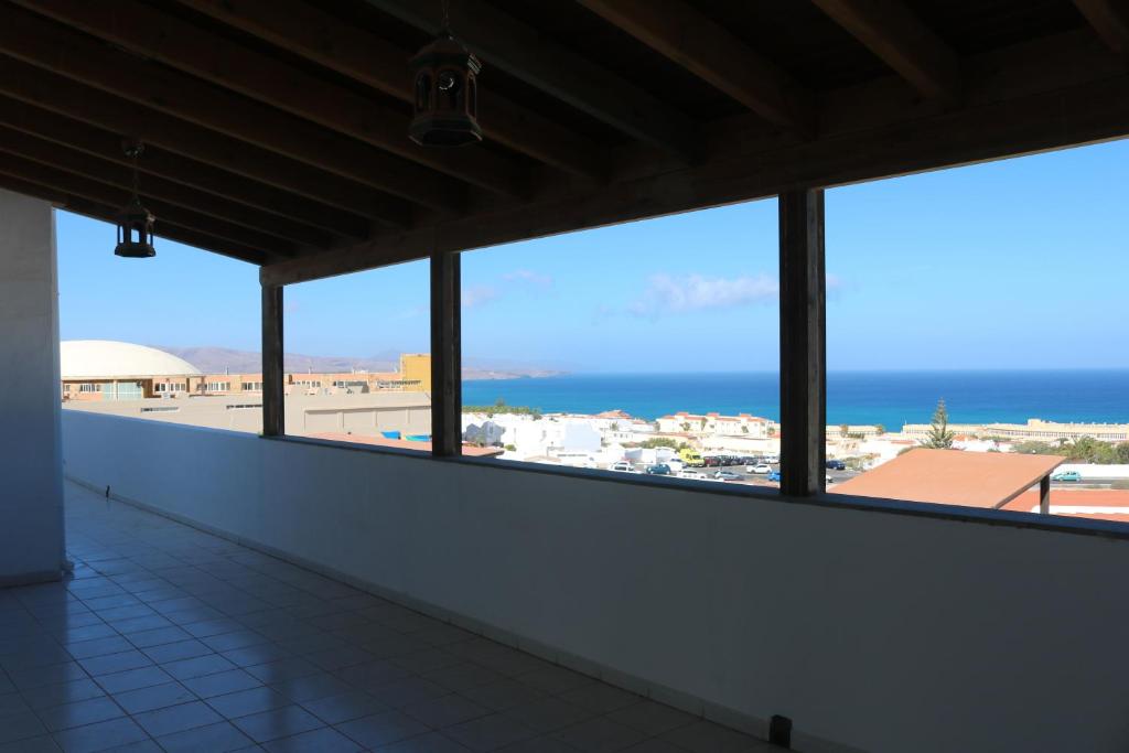a view of the ocean from a room with windows at 3C Fuerteventura in Costa Calma