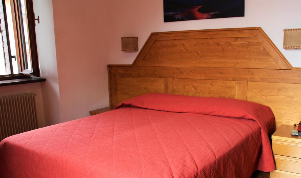 Postel nebo postele na pokoji v ubytování Hotel Paganella