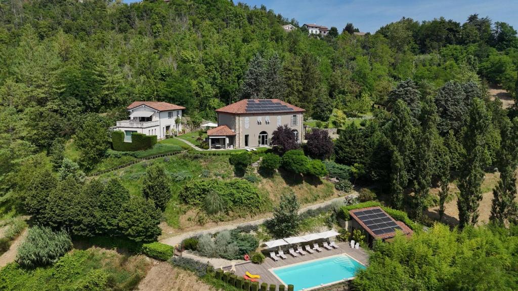 an aerial view of a house on a hill with a pool at Tenuta Moncarlino in Morsasco