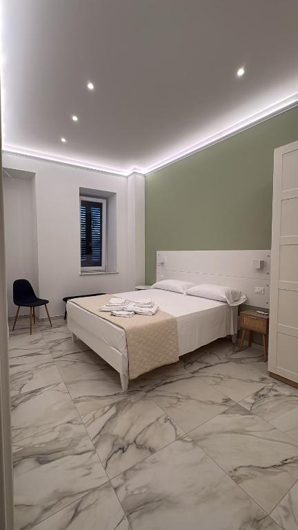 a bedroom with a large bed in a room at Casa del Corso in Parghelia