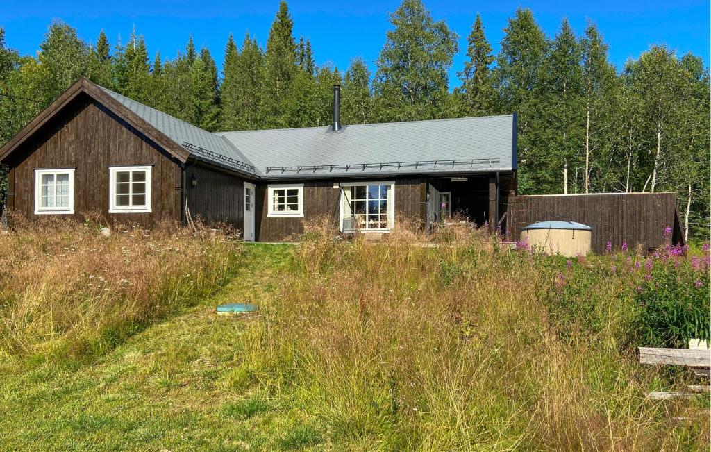 a house in the middle of a field at Awesome Home In Trysil With Sauna in Trysil