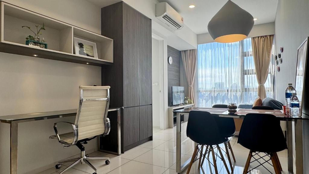 a kitchen with a table and chairs in a room at Panoramic KL View @Robertson Bukit Bintang 40f in Kuala Lumpur