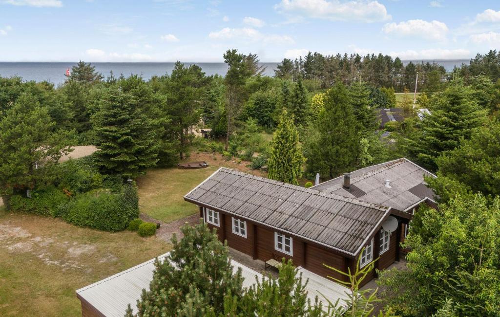 an overhead view of a house with a roof at Nice Home In Tarm With Swimming Pool in Tarm