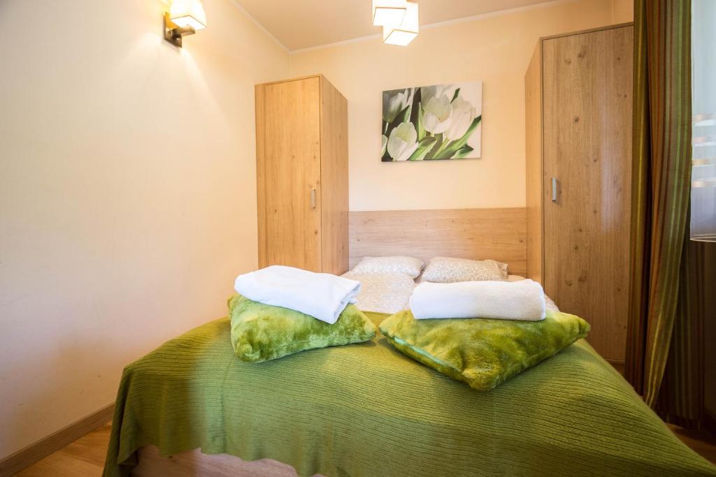 Posteľ alebo postele v izbe v ubytovaní Apartamenty Smrekowa Zakopane
