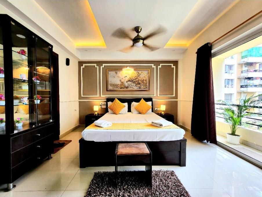 Ένα ή περισσότερα κρεβάτια σε δωμάτιο στο Siddha Xanadu Studio Apartment # 334 Kolkata