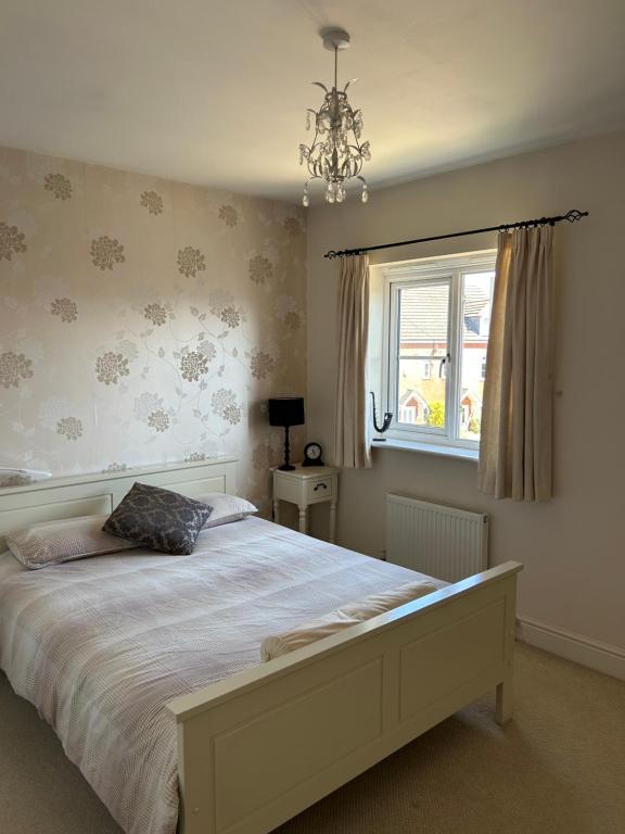 Ένα ή περισσότερα κρεβάτια σε δωμάτιο στο Northants Guest House