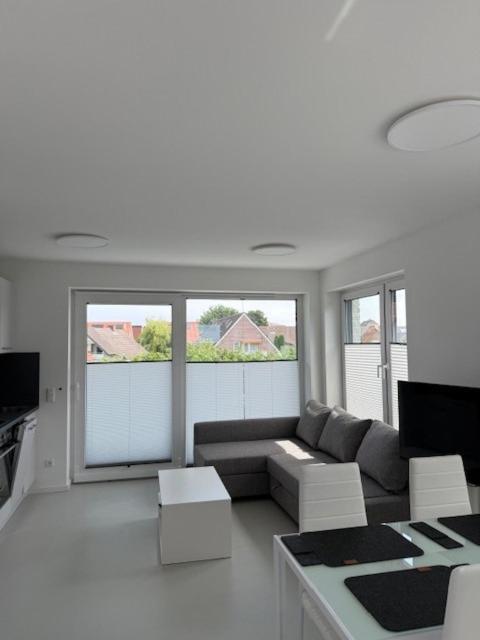 a living room with a couch and a table at Haus am Wittenwiewerbarg in Dahme