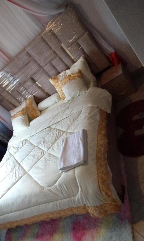 Postel nebo postele na pokoji v ubytování Pineapple Apartments