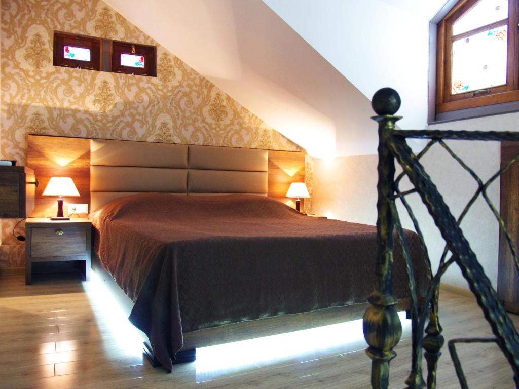 Postel nebo postele na pokoji v ubytování ApartHotel Heart of Tbilisi