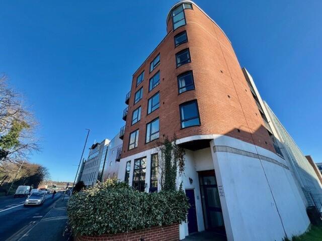 a red brick building with aventh floor at North Point, Leeds City Centre in Central Station