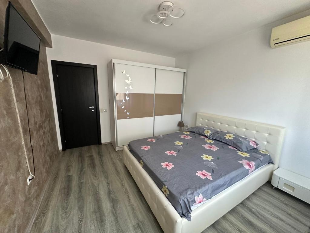 Postel nebo postele na pokoji v ubytování Louisa Apartament