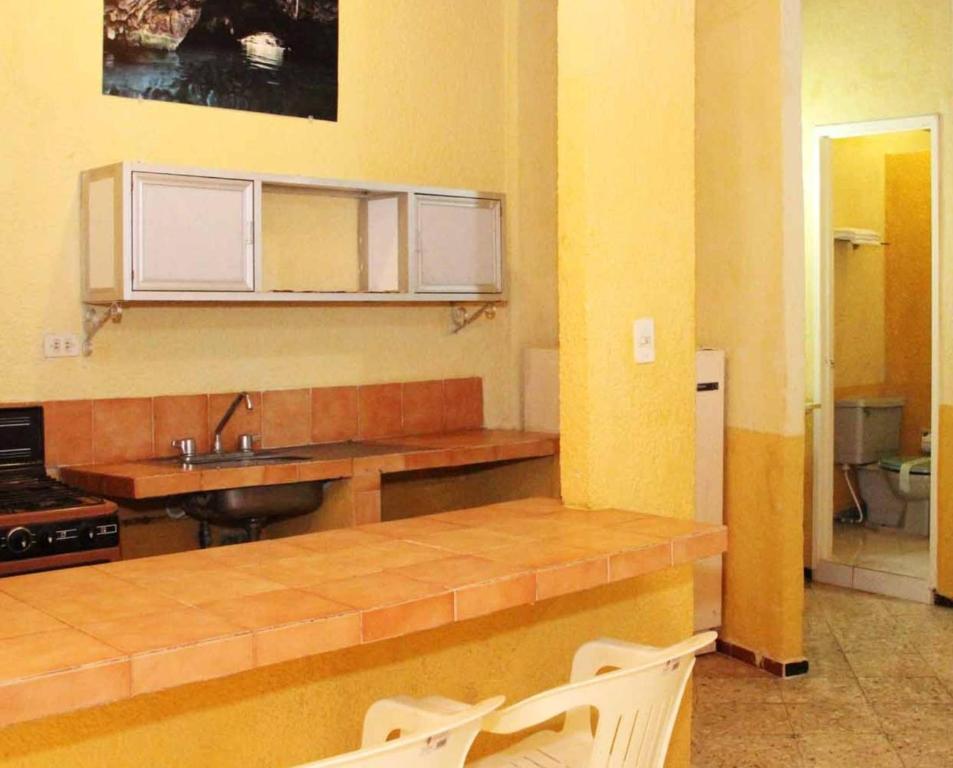 Kuchyň nebo kuchyňský kout v ubytování Hotel Suites Elia Noemi