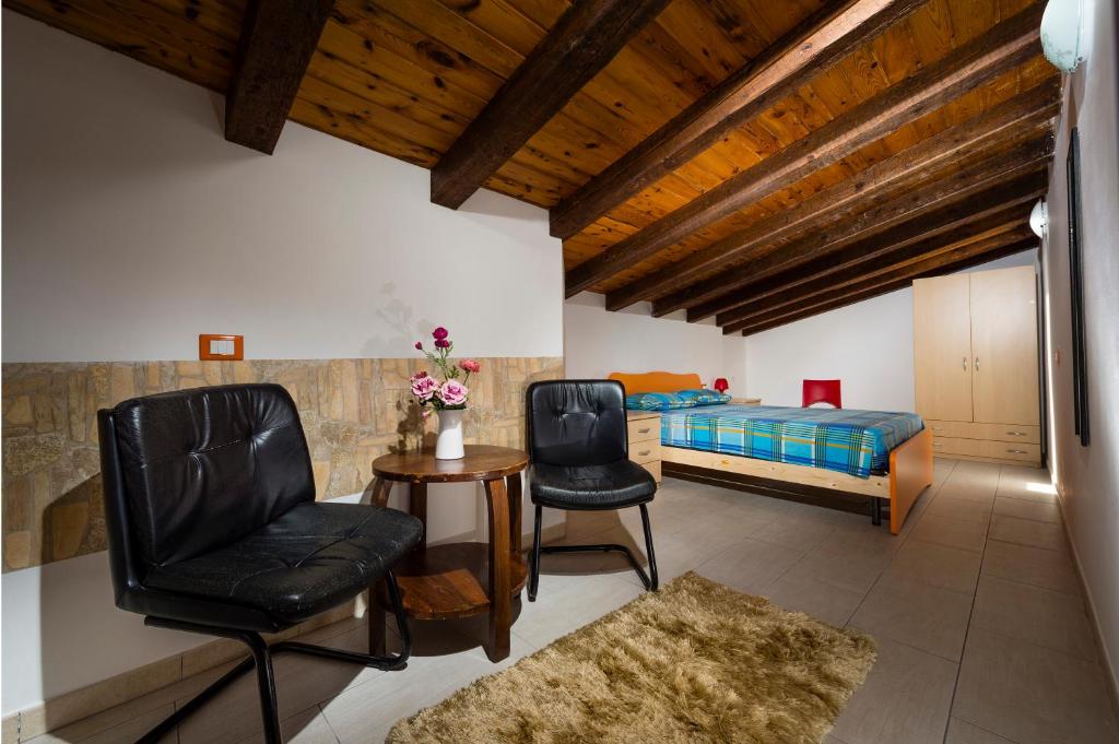 Łóżko lub łóżka w pokoju w obiekcie Casa Vacanze Cappuccini