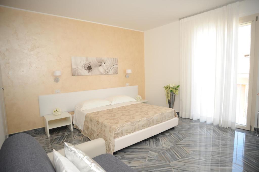 A bed or beds in a room at Casa Alfieri"rooms and Apartments"