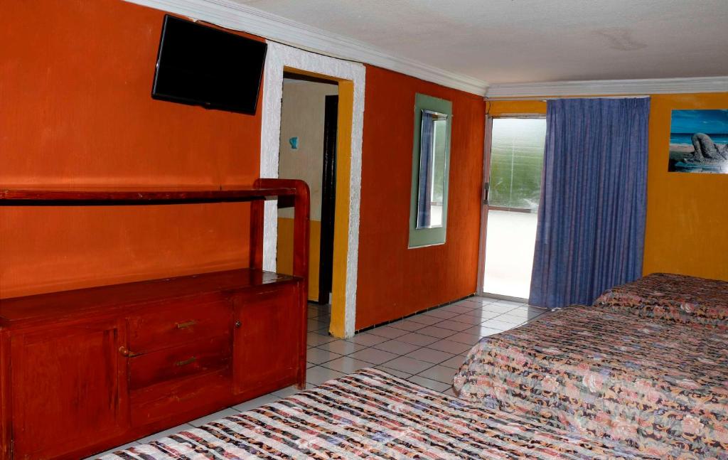 Postel nebo postele na pokoji v ubytování Hotel Suites Elia Noemi