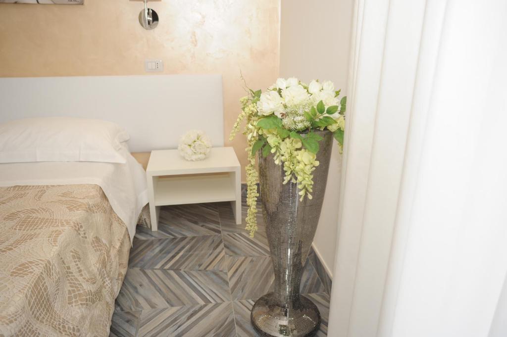 A bed or beds in a room at Casa Alfieri"rooms and Apartments"
