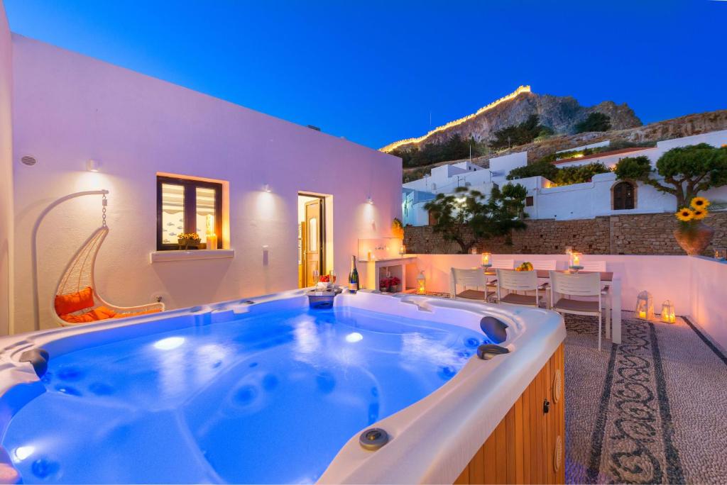 a jacuzzi tub in the middle of a house at Lindos Diamond Exclusive Villa in Lindos