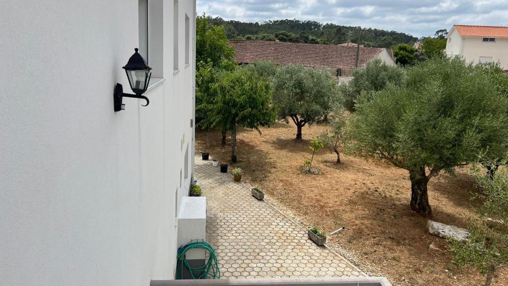 a view of a garden from a building with a street light at Fátima Fátima in Fátima