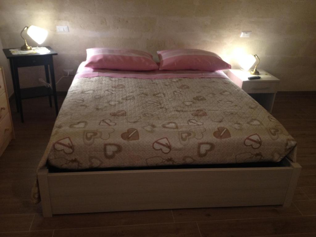 Postel nebo postele na pokoji v ubytování Le due arcate