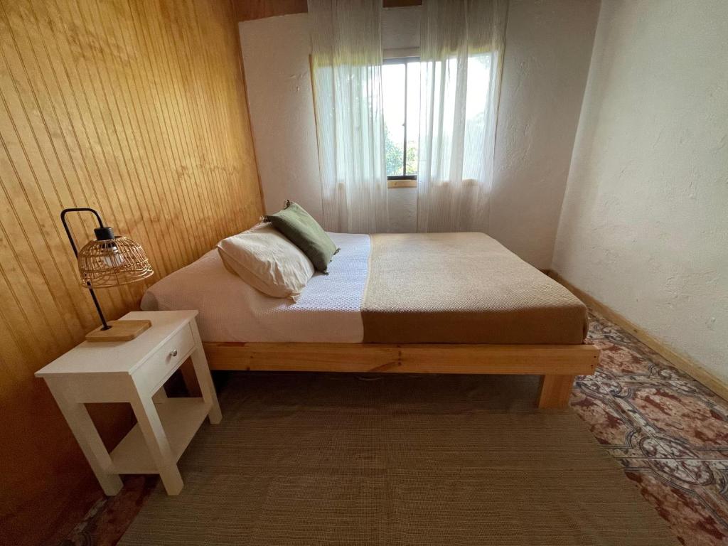 Voodi või voodid majutusasutuse Tai Rapa Nui toas