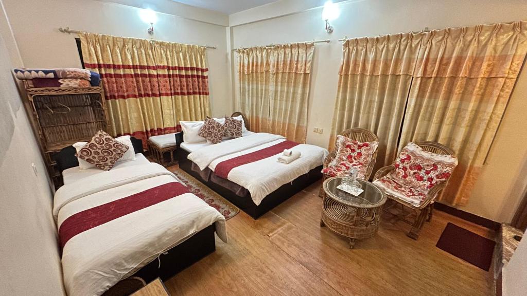 Voodi või voodid majutusasutuse Cherry Garden Pokhara toas