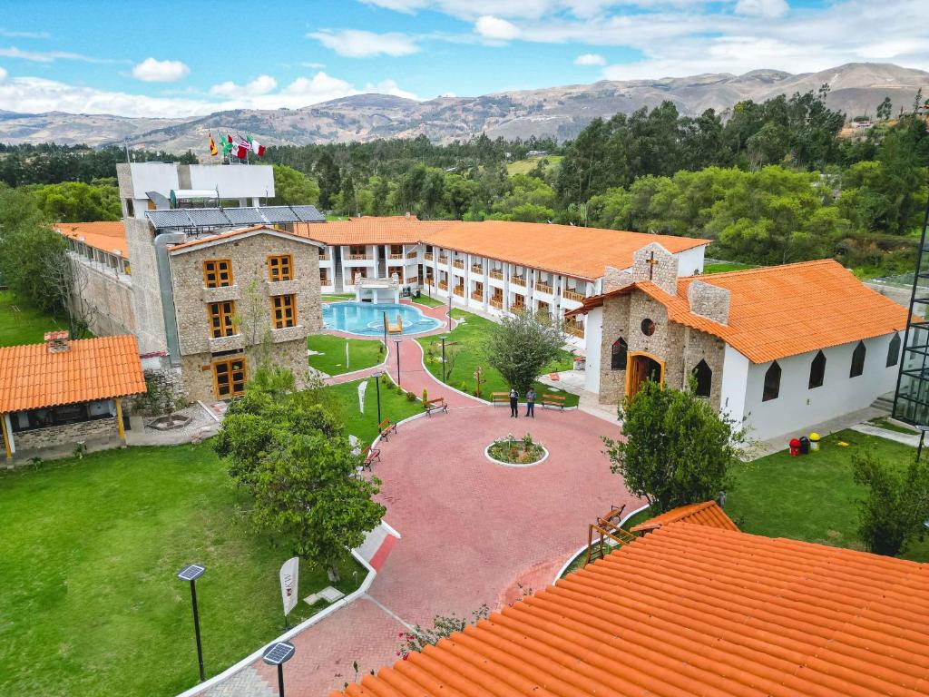 an aerial view of a school building with a pool at Gran Kuntur Wasi Hotel Casa y Campo in Cajamarca