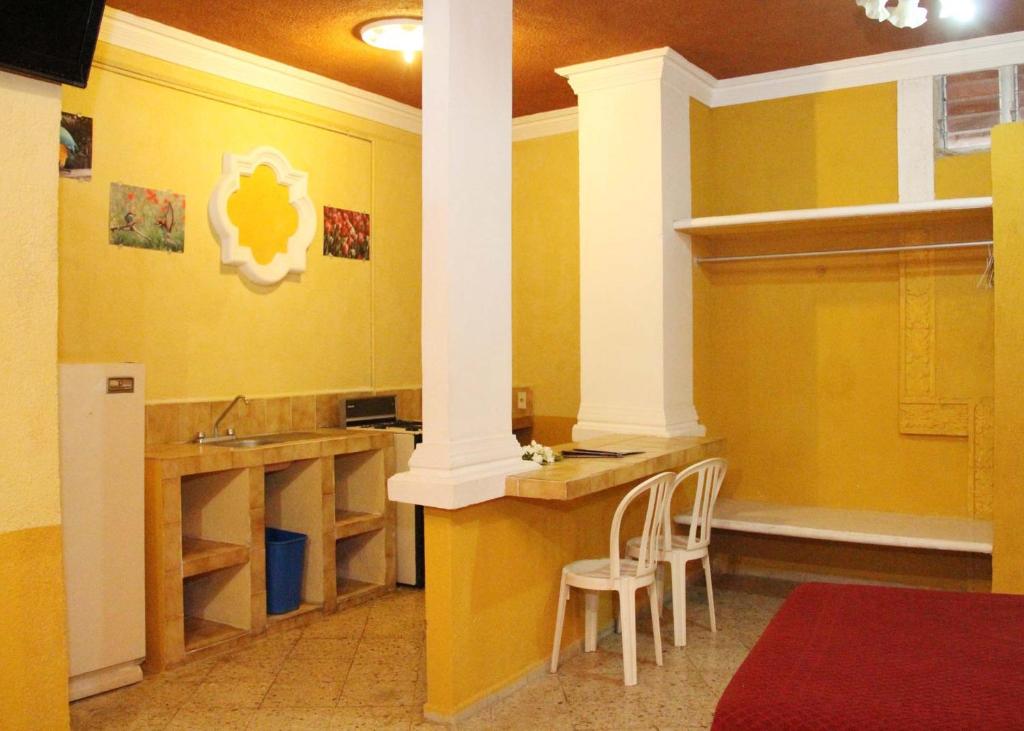Kuchyň nebo kuchyňský kout v ubytování Hotel Suites Elia Noemi